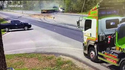 Articulated lorry smashes into car making a right turn across dual-carriageway in Thailand