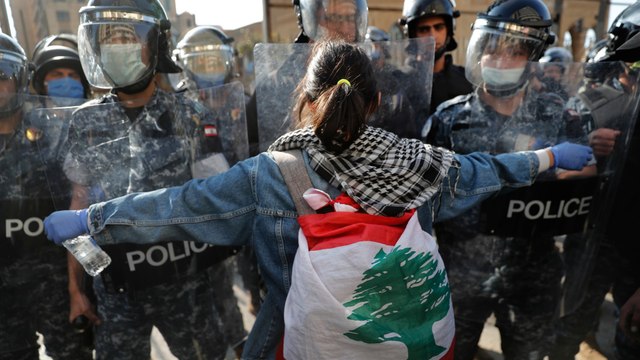 One dead, dozens injured in Lebanon riots with banks smashed