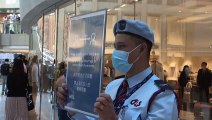 Hong Kong: Dozens gather for lunchtime protest