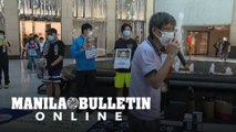Hong Kong: Dozens gather for lunchtime protest