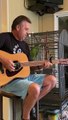Parrot Sings Along With Man Playing Guitar