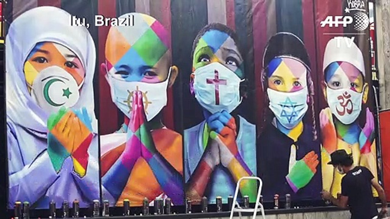 Brazilian street artist paints mural promoting unity amid pandemic