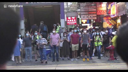 Protesters return to Hong Kong's streets to mark anniversary of Prince Edward station attack