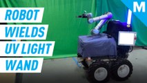 This robotic arm carries a UV light wand to disinfect public spaces