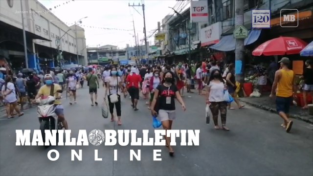 Market goers scramble at Pritil Public Market day before the implementation of the 48-hour Hard Lockdown in Tondo