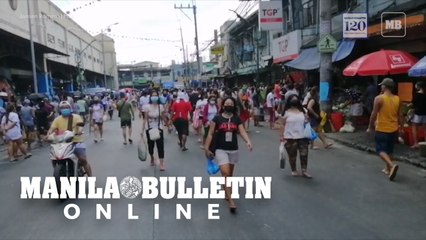 Market goers scramble at Pritil Public Market day before the implementation of the 48-hour Hard Lockdown in Tondo