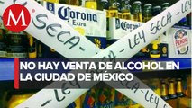 Con letreros, cintas y periódicos, tienditas ahuyentan a consumidores de alcohol en CdMx