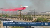 Active fire engulfs three buildings near busy Valley freeway