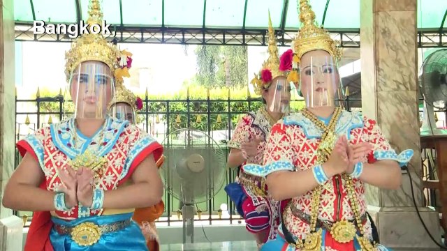 Bangkok shrine gives dancers face shields