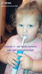 Little Girl Uses an Electric Toothbrush for the First Time