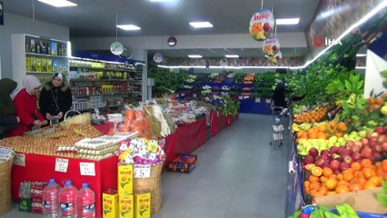 Vatandaşın, marketteki hırsızlığı köpeği ile engellediği anlar kamerada