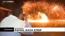 Palestinian youth swirl homemade sparkler firework for Ramadan