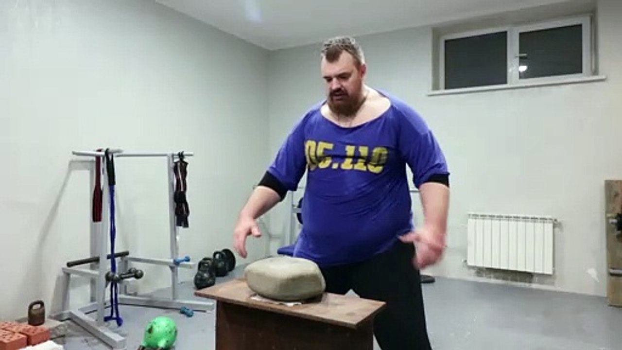 Russian Man Demonstrates Big Stone Hand Training