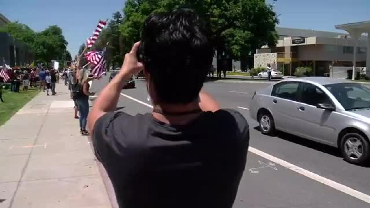 Hundreds gather to protest for reopening the county