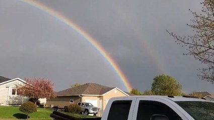 Stunning double rainbow appears after thunderstorm