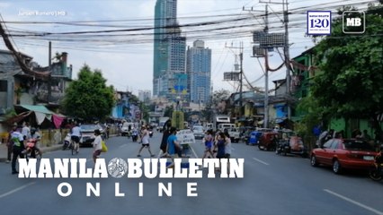 Residents crosses the road before the implementation of the one-week hard lockdown
