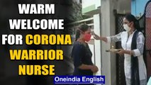 Nagpur nurse gets a warm welcome after return from 1 month of Covid-19 duty: watch | Oneindia News