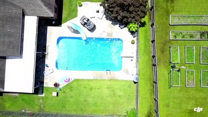 Man in Birthday Suit Jumps into Swimming Pool on a Sunny Day