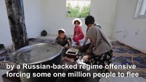 Displaced Syrian family returns to destroyed frontline Idlib town over virus fears