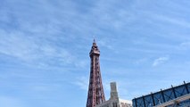 Flag on top of Blackpool tower made from artwork from local residents