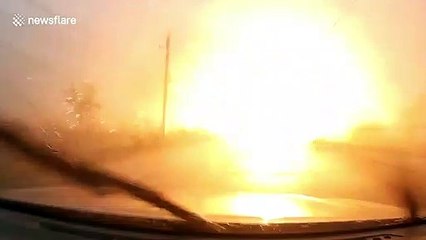 Driver narrowly avoids being electrocuted when power lines blow down in storm