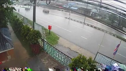 Security cam captures moment truck skids on wet road and slams into electricity post