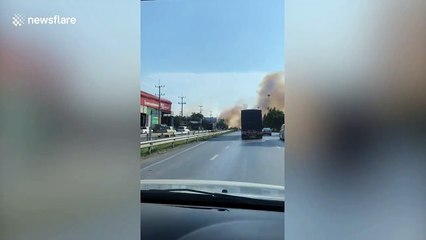 Drivers engulfed by clouds of smoke from farm fires in Thailand