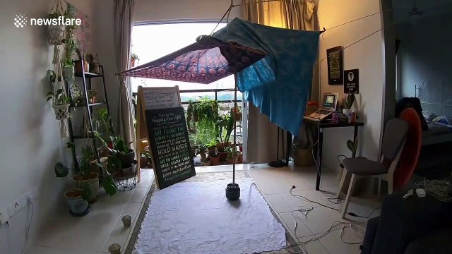 Malaysian couple build 'romantic fort' out of blankets to cure their lockdown boredom