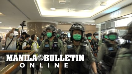 Riot police chase Hong Kong Mother's Day protesters