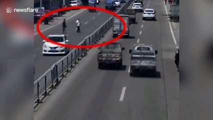 Central reservation falls like dominos after alleged drunk man pushes them down to cross road in China