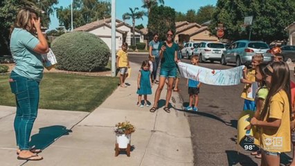 Students surprise teacher with parade