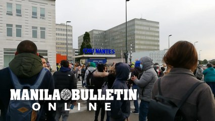 Hundreds protest outside French hospital over virus response