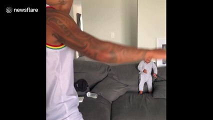 Father and eight-month-old son perform traditional haka dance together