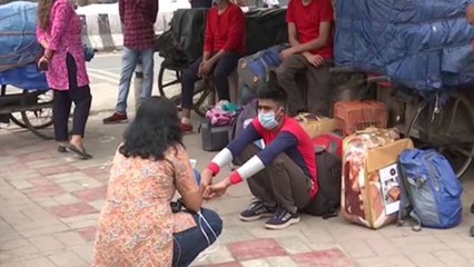 People gather outside station as train services resume