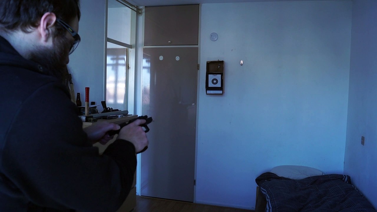 Shooting through a target 5 times, with an airsoft handgun