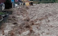 People risk lives, drive through the furious flow of flood water in Uttarakhand