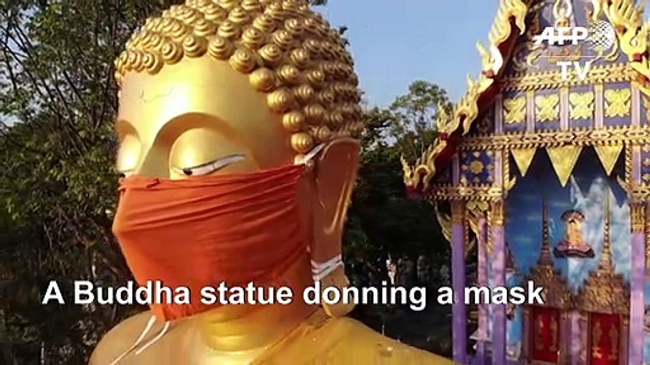 Thai temple puts face mask on giant Buddha statue