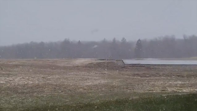 Late-season snow falls on Maine