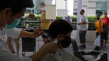 Singaporeans head to hair salons as some coronavirus measures slightly eased