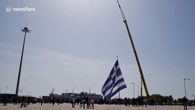 'Largest Greek flag ever' hoisted into position with crane near Turkey border