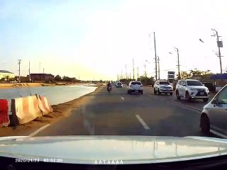 Van Dodging a Turning Car Clips Motorcyclist