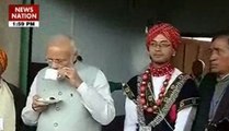 PM Narendra Modi sips tea, tries hands on drums in Meghalaya