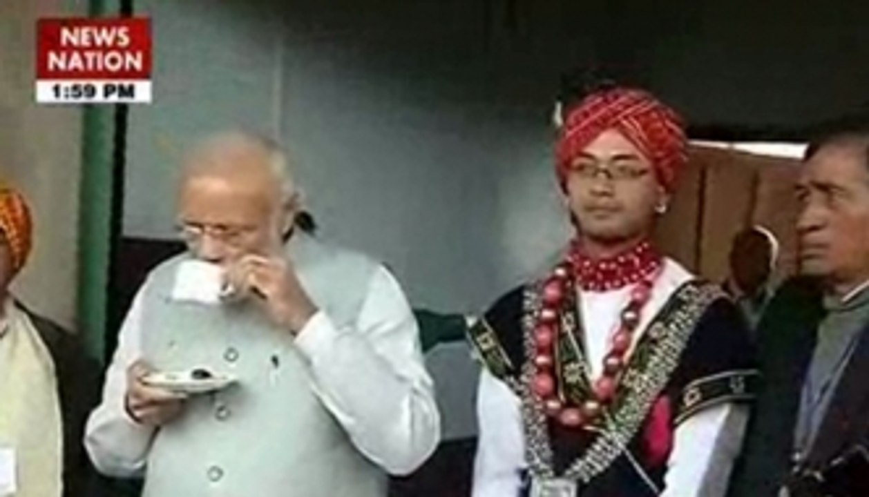 PM Narendra Modi sips tea, tries hands on drums in Meghalaya