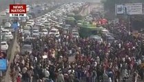 Sanitation workers block roads in Delhi