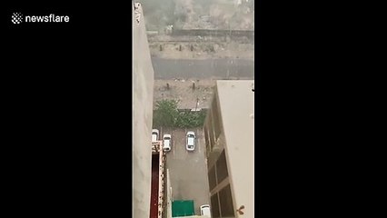 Amazing footage of torrential rain and a dust storm combining over Delhi in India