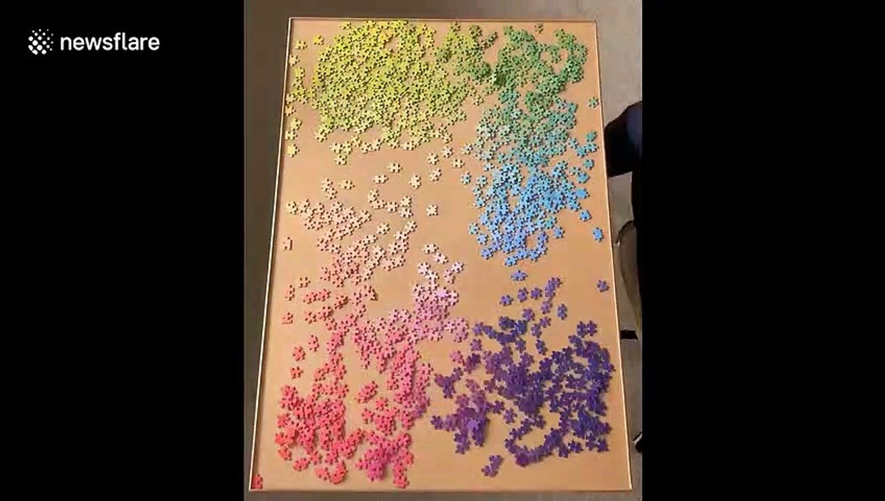 Satisfying timelapse shows completion of large rainbow-coloured jigsaw puzzle