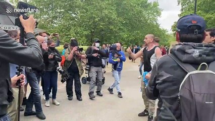 Anti-lockdown protester give out "free hugs" at demo in London's Hyde Park