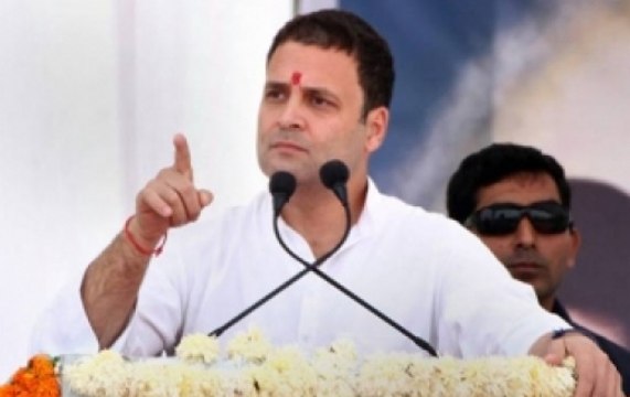 Congress Vice-President Rahul Gandhi stands in line with public at Delhi airport