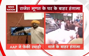 AAP workers throw black ink on PWD minister Rajesh Munat's name plate