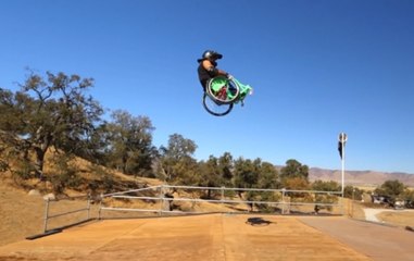 Physically challenged man performs stunt on wheelchair